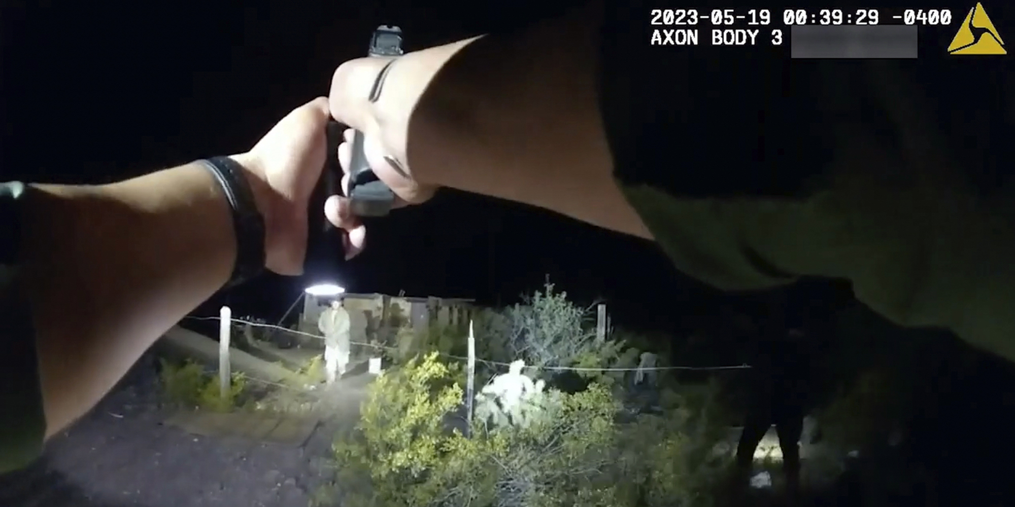 In this image taken from body camera video released Thursday, June 22, 2023, by U.S. Customs and Border Protection, an agent points a gun at tribal member Raymond Mattia, early Friday, May 19, in Tohono O'odham Nation, in southern Arizona.