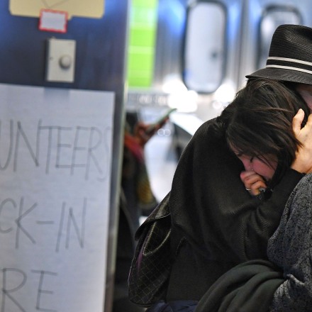 A woman of Iranian descent (R) cries as she waits for a family member after the immigration ban imposed by U.S. President Donald Trump at the Los Angeles International Airport, California on January 30, 2017.Trump's executive order suspended the arrival of all refugees for at least 120 days, Syrian refugees indefinitely -- and bars citizens from Iran, Iraq, Libya, Somalia, Sudan, Syria and Yemen for 90 days. Protests are taking place at airports across the country in opposition to the ban. / AFP / Mark RALSTON (Photo credit should read MARK RALSTON/AFP/Getty Images)