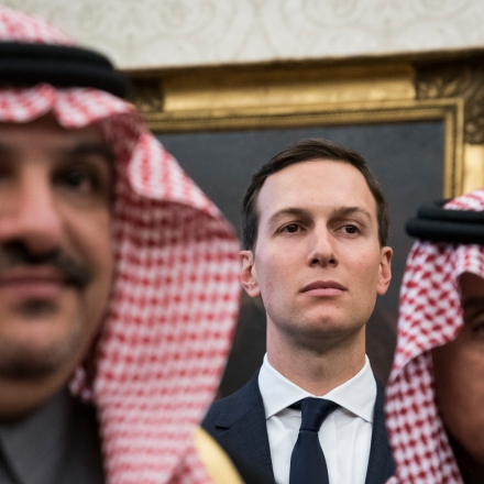 White House senior adviser Jared Kushner stands among Saudi officials as former President Donald Trump talks with Crown Prince Mohammad bin Salman of the Kingdom of Saudi Arabia at the White House, March 20, 2018 in Wash