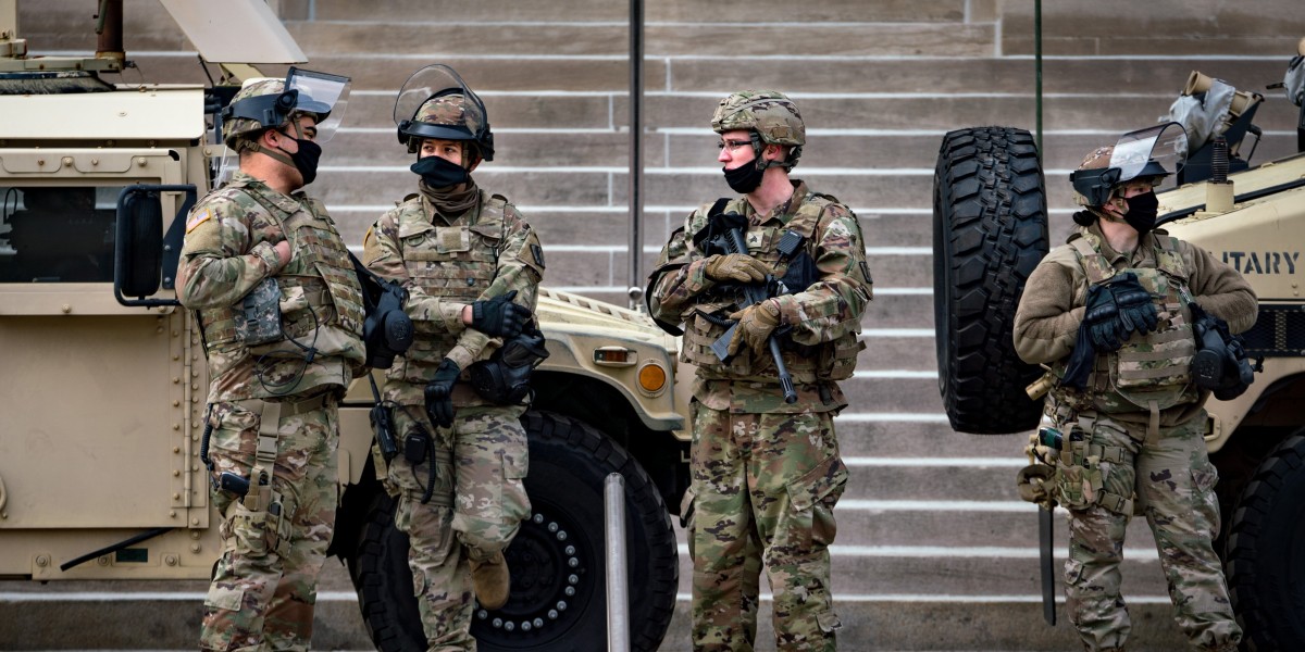 Members of the National Guard stand outside the Georgia State Capitol in Atlanta, Georgia, Jan. 17, 2021.