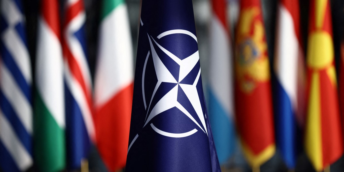 A picture shows the flag of the North Atlantic Treaty Organization (NATO) prior to the Meeting of NATO Ministers of Defence in Brussels, on October 21, 2021 (Photo by Kenzo Tribouillard / AFP) (Photo by KENZO TRIBOUILLARD/AFP via Getty Images)