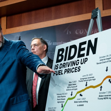 Senator Ted Cruz points to a "Biden Is Driving Up Fuel Prices" board while speaking during a news conference on gasoline prices at the Capitol in Washington, D.C., US, May 18, 2022.