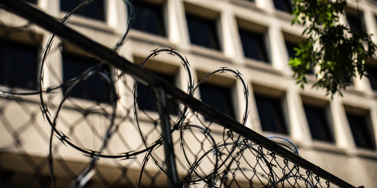 Security fencing surrounds a portion of the Federal Bureau of Investigation (FBI) headquarters in Washington, D.C., US, on Monday, Aug. 22, 2022. The FBI has come under intense political criticism for executing a search warrant on Donald Trump's Mar-a-Lago home in Florida and is confronting threats that don't appear to be subsiding, including an armed man who attacked the bureau's Cincinnati field office. Photographer: Al Drago/Bloomberg via Getty Images