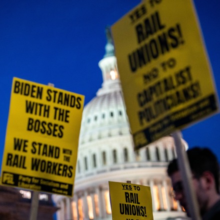 WASHINGTON, DC - NOVEMBER 29:  Activists in support of unionized rail workers protest outside the House side of the U.S. Capitol Building on Tuesday, Nov. 29, 2022 in Washington, DC. President Joe Biden has called on Congress to pass legislation averting a railroad shutdown ahead of the December 9 coordinated strike date.  (Kent Nishimura / Los Angeles Times via Getty Images)