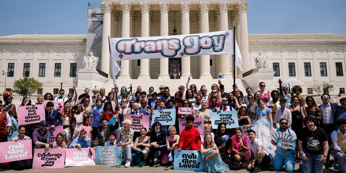 WASHINGTON, DC - MAY 22: Participants in the "Trans Youth Prom" pose for a photo in front of the U.S. Supreme Court Building on May 22, 2023 in Washington, DC. Trans and non-binary youth gathered outside of the U.S. Capitol Building to hold a Prom like event that included music, dancing and speeches. (Photo by Anna Moneymaker/Getty Images)